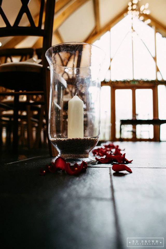 Petals + Hurricane Vases in Aisle